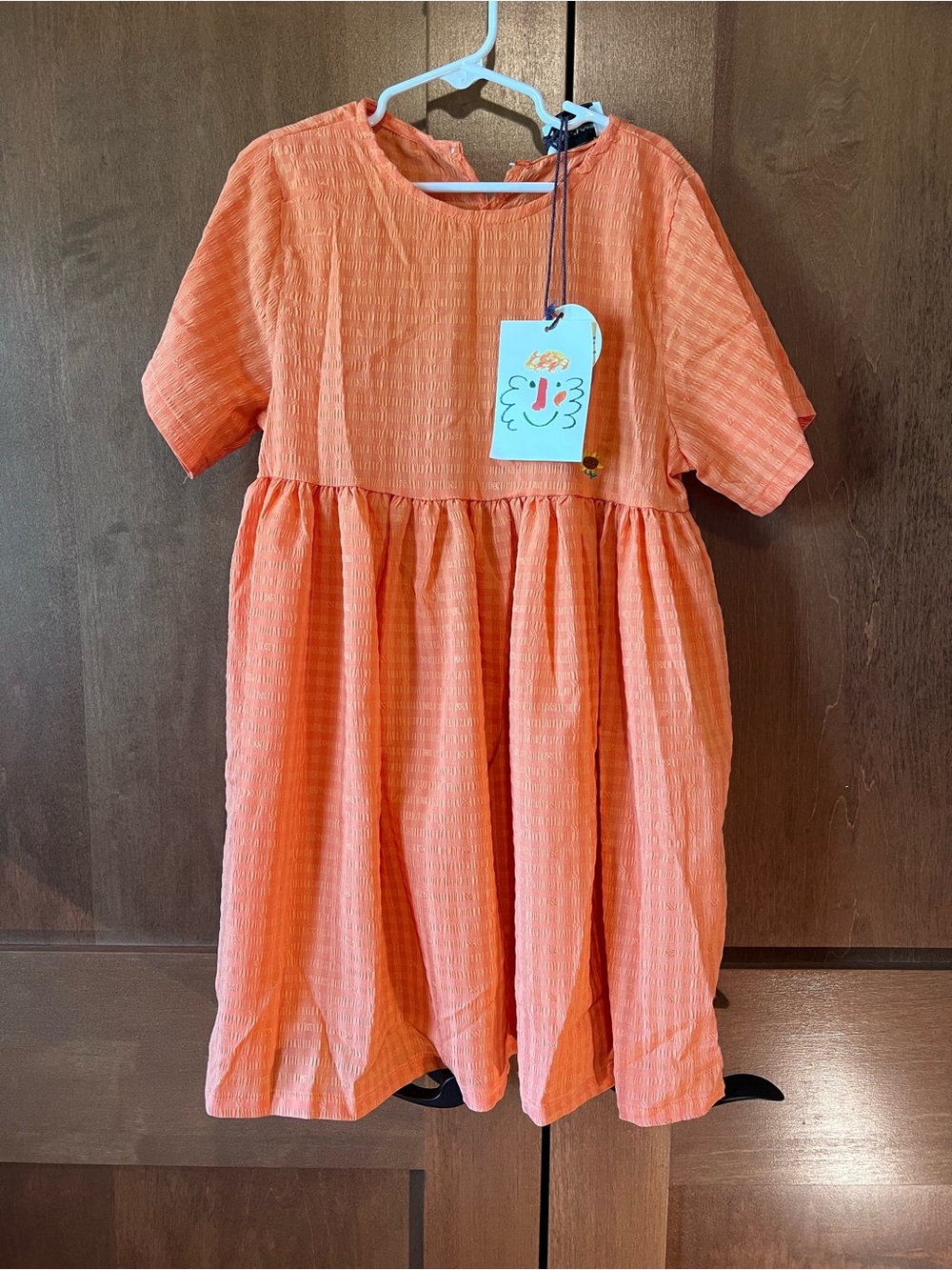 Bobo Choses nwt Msrp 68$ on sale right now. Orange Textured Dress